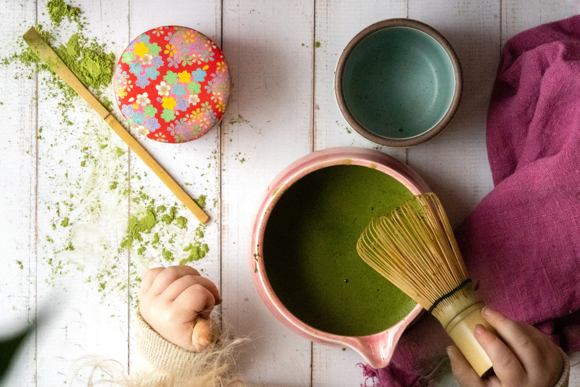 Whisking matcha in a traditional bowl